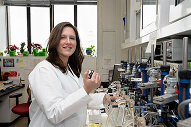 Photo of a woman working in the lab. Link to Gifts by Will.