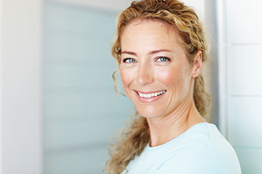 Photo of a woman smiling for a picture. Link to Life Stage Gift Planner Under Age 45 Situations.