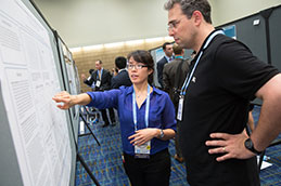 Photo of two people looking at a presentation. Link to What to Give. What-to-Give.jpg